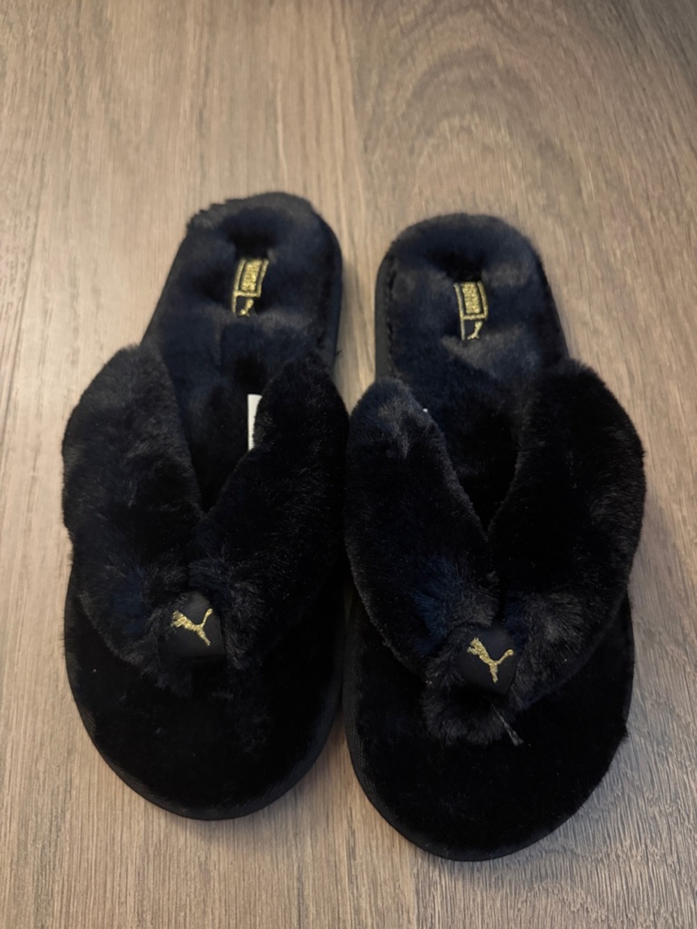 Puma Women's Black Plush Thong Slippers with Gold Logo